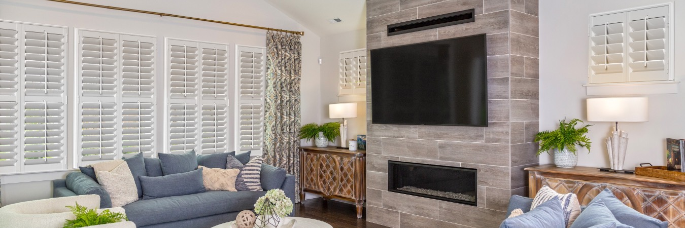 Plantation shutters in Skokie family room with fireplace
