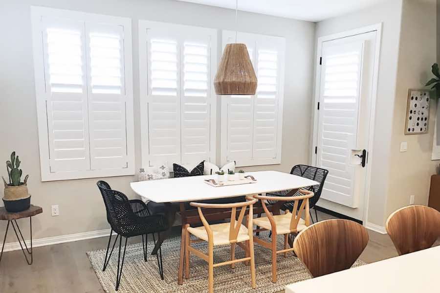 Use Polywood shutters to control natural light levels in your Chicago dining room. Polywood shutters with top louvers tilted open in a dining room