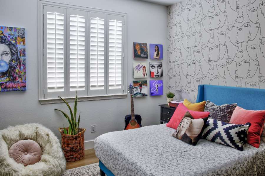 Polywood interior window shutter allowing light into bedroom