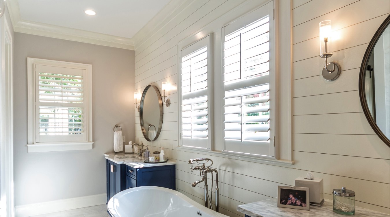 Chicago bathroom with white plantation shutters.