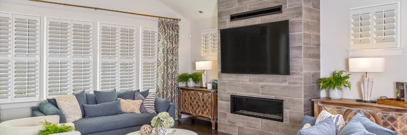 Plantation shutters in Chicago family room with fireplace