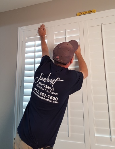 Shutter installation in Chicago bedroom.