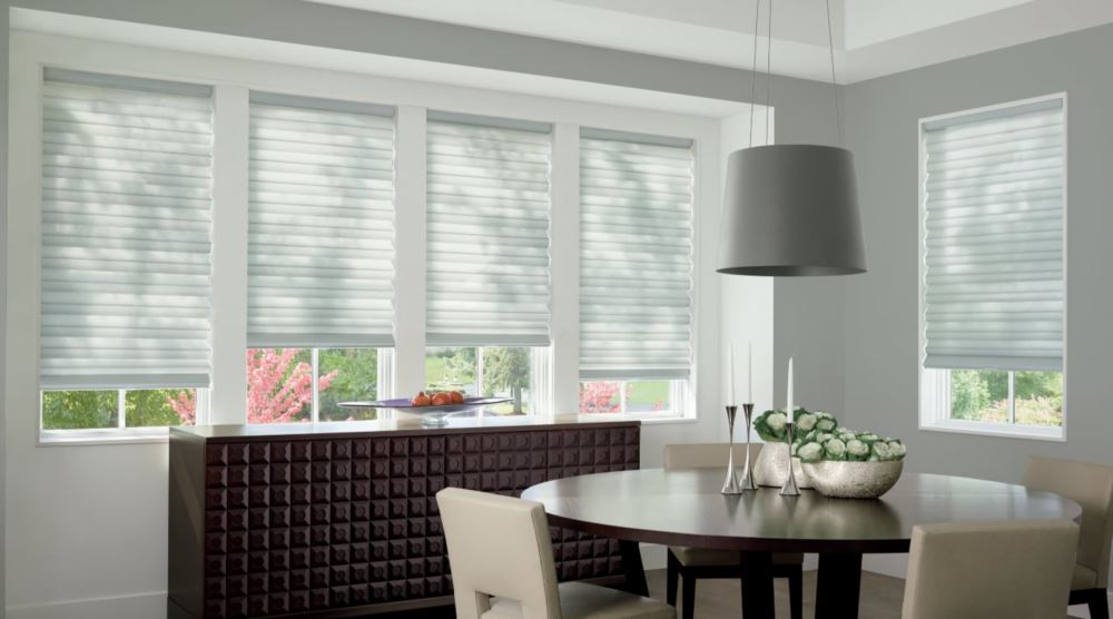 Custom cordless roller shades have a clean look and are appropriate for any room. Cordless motorized shades in a Chicago dining room