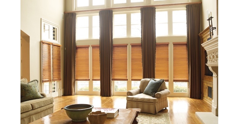 Chicago great room with wood blinds and floor to ceiling draperies. Chicago great room with wood blinds and floor to ceiling draperies.