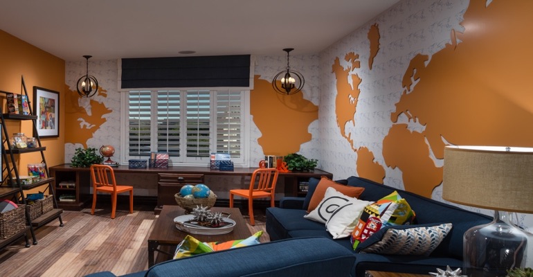 Plantation shutters are the perfect window treatment for a learning area. Family room with wall map and plantation shutters