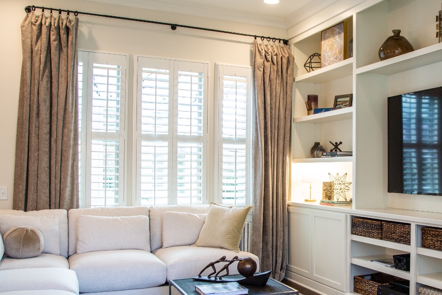 Install sun-resistant Polywood shutters in Chicago. Shutters in a living room
