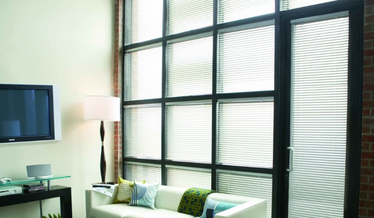 Traditional blinds can become twisted, discoloured, and bent. Metal Blinds in a living room.