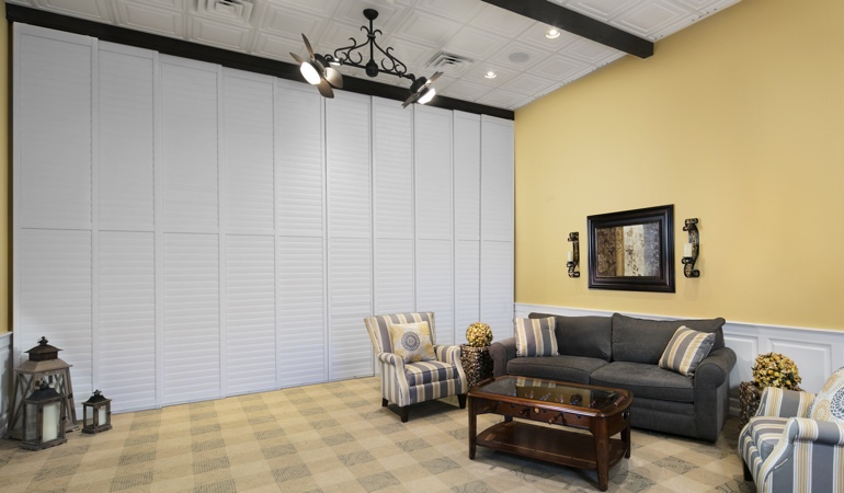 Plantation shutters can be used to divide up a room. Shutters as a room divider for a showroom