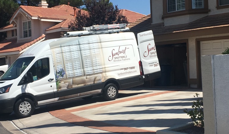 At an in-home consultation, we take the showroom to your room. Alt text: Sunburst Shutters van in customer's driveway.