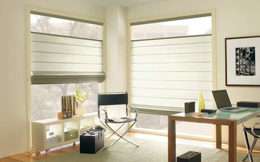 Upgrade your windows with stylish window shades or shutters in Chicago. Stylish sheer shades in the corner of a modern office.