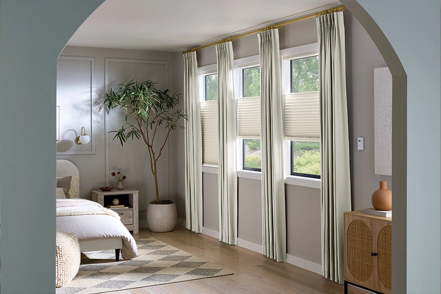White motorized shades on bedroom windows